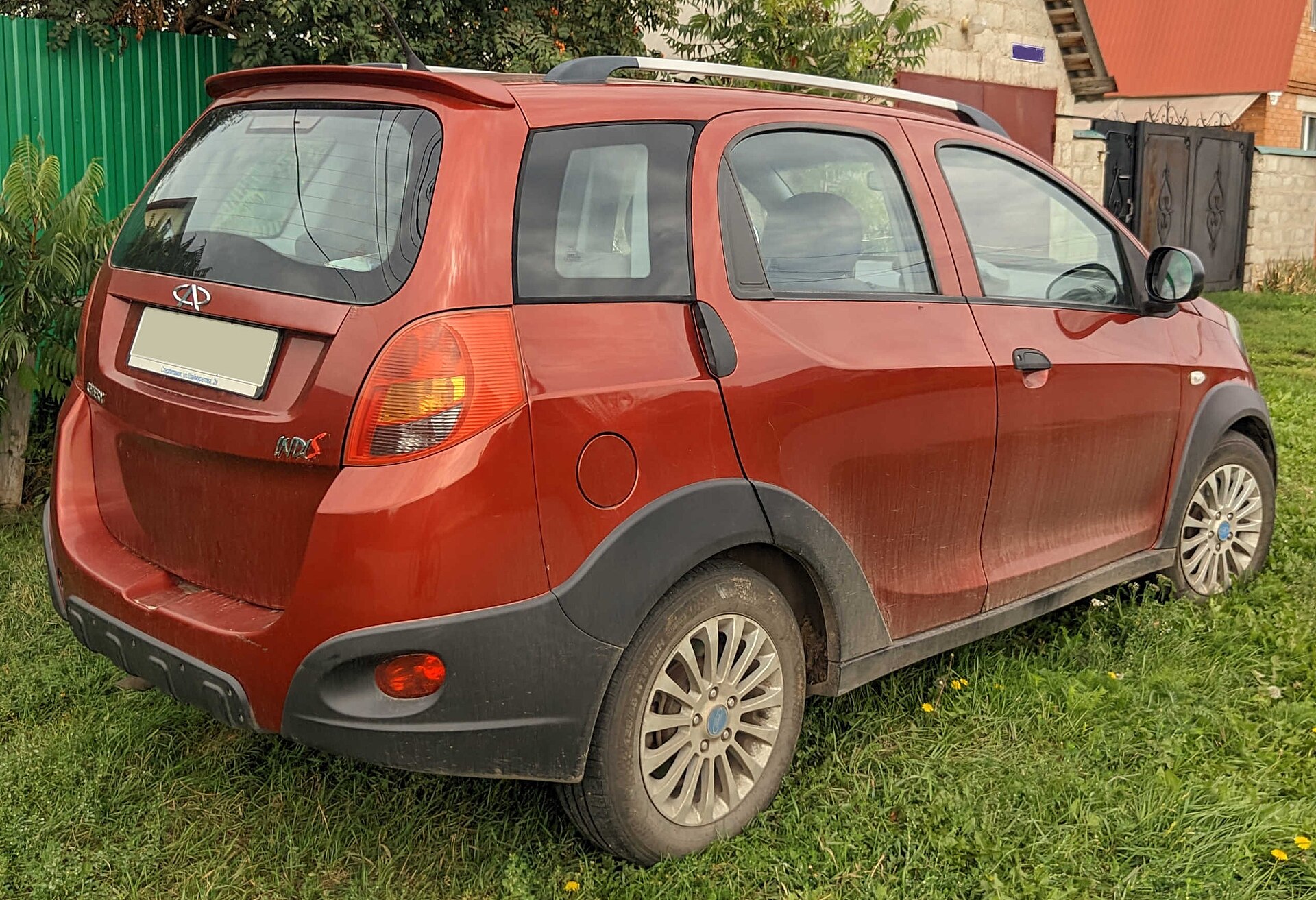 Rear view of a red Chery IndiS