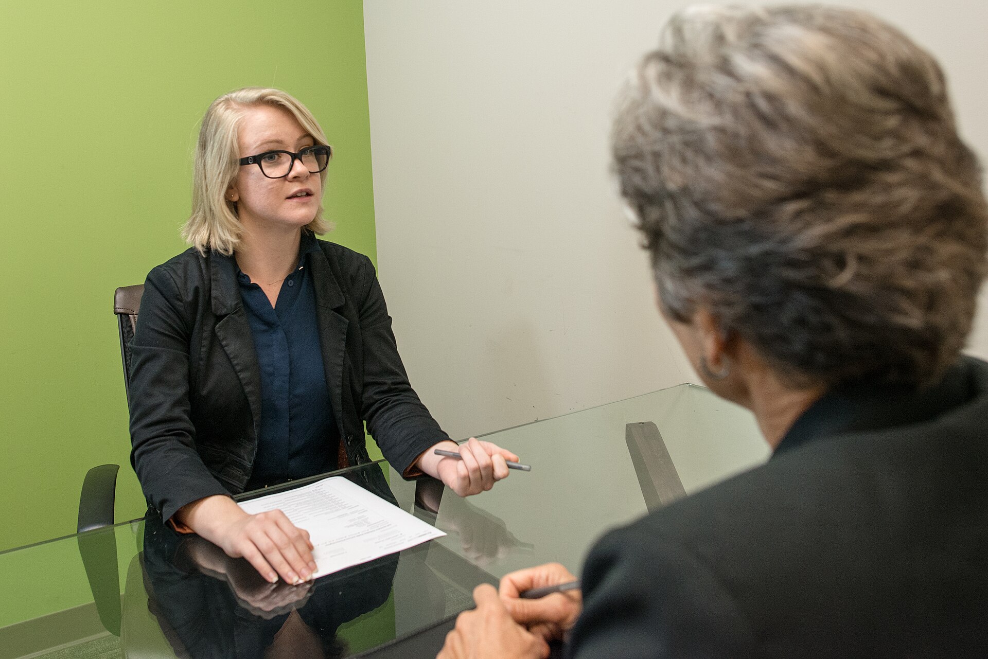 Young white woman on a job interview with a mature woman When using the image please provide photo credit (link) to: https://www.amtec.us.com per these terms: www.amtec.us.com/creative-commons