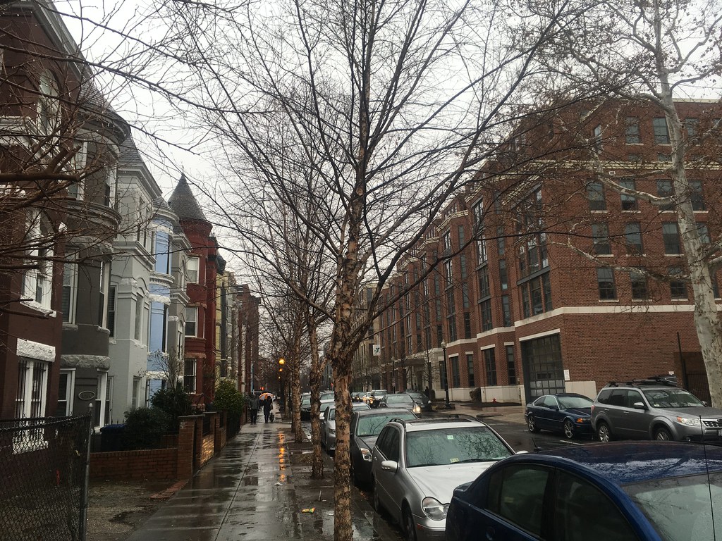 Rowhouses with new apartment building across the street
