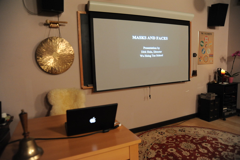 Masks and Faces, educational lecture, Metal gong, brass bell, Apple laptop computer, blackboard, screen, sheep skin, rug, sound system, Wu Hsing Tao School, Traditional 5 Element Acupuncture and Psychology, Seattle, Washington, USA