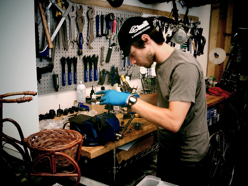 Jon from Flying Pigeon LA bike shop working on an old hub