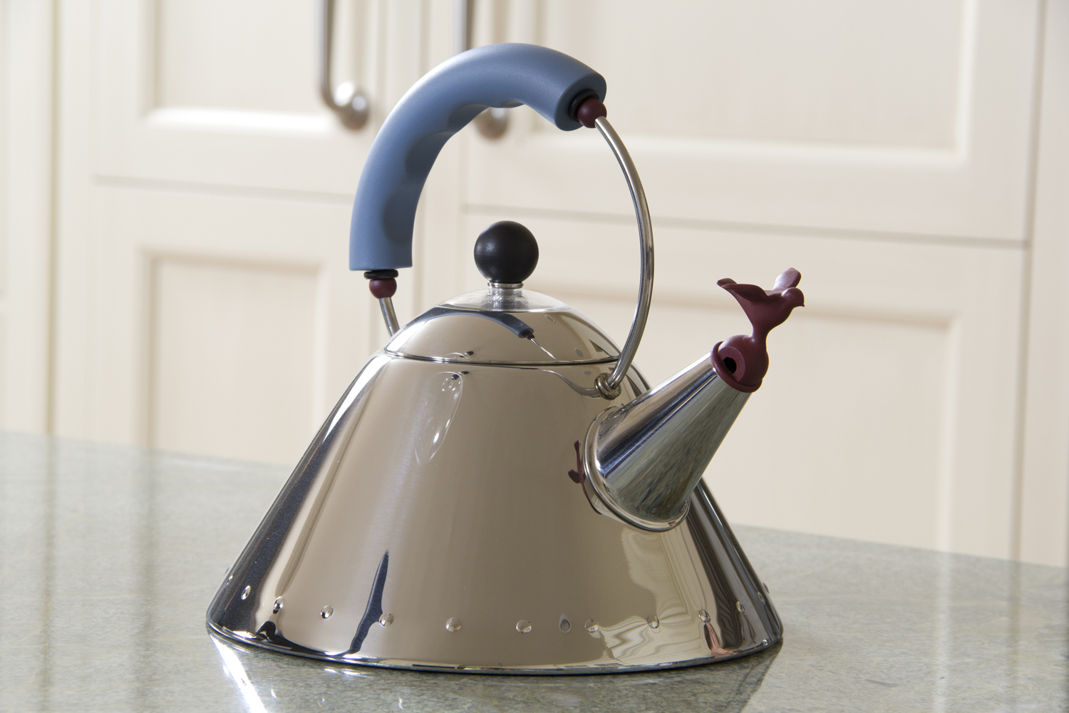 Tea kettle model 9093 designed by Michael Graves for Alessi in 1985