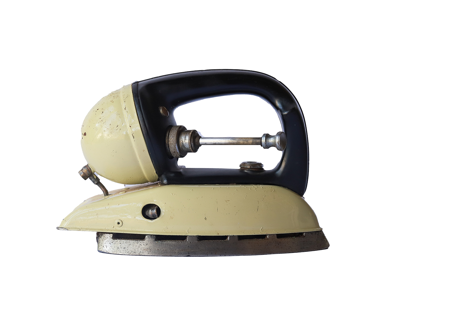 Paraffin pressure domestic iron (front view) Paraffin pressure domestic iron produced probably between the 1920s and 1950s - The design of the handle and control knob was made in collaboration with Insulators Ltd who created a design where the spaces for the controls are moulded in and must be accurate for assembly purposes. Power source : Kerosene fuelled Kerosene reservoir, as body, attached to rear of handle with filling port and pressure pump protruding into the handle; control top at rear, ignition port on right hand side; Shape and finishing : Finished in black and cream baked enamel finish and with chromium plated sole plate Conventional shaped cast and plated Black synthetic polymer handle Patents: British Pat. 524719 Australian Pat. 114305 DIMENSIONS Height : 160 mm Width : 120 mm