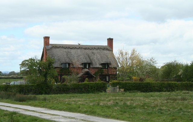 Thatched cottage on Rodens Hall Road at Sutton Green in Isycoed, Wales.