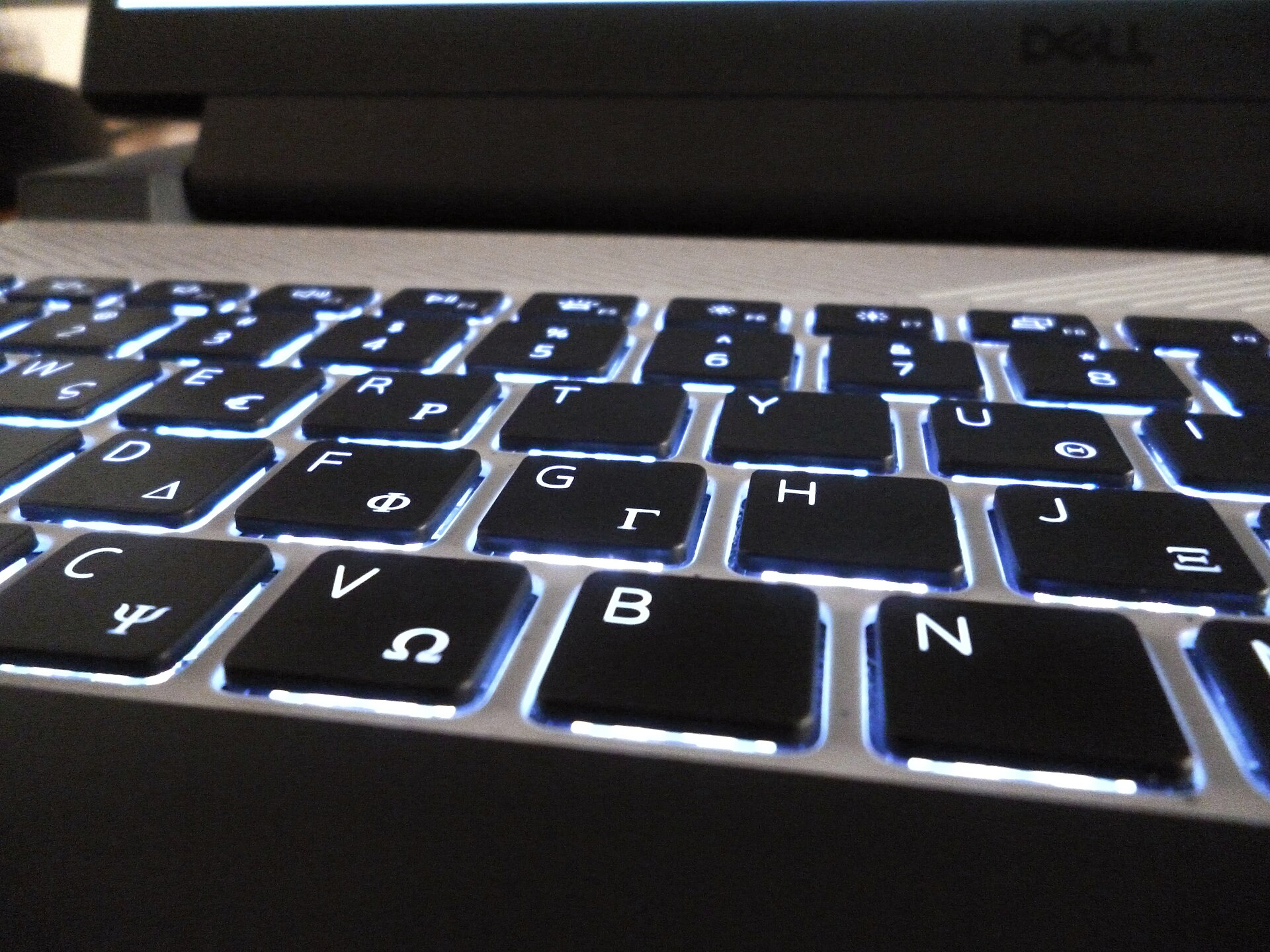 A keyboard of a laptop, with a backlight.