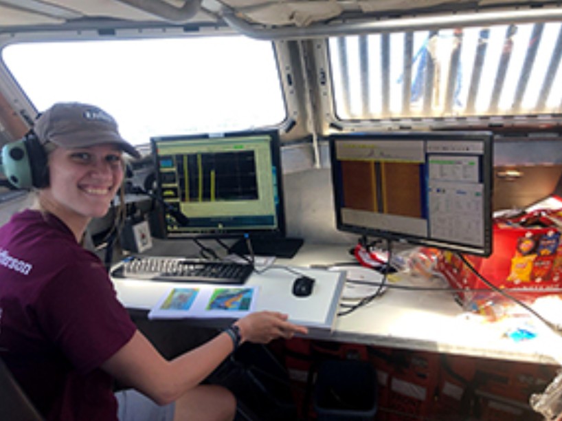 A University of New Hampshire summer intern logs sidescan sonar data aboard the survey ship NOAAS Thomas Jefferson (S 222) in 2021.